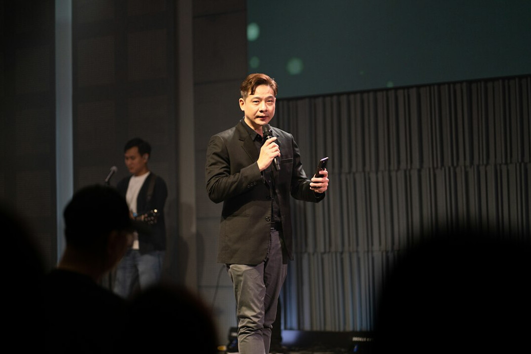 person speaking confidently on stage