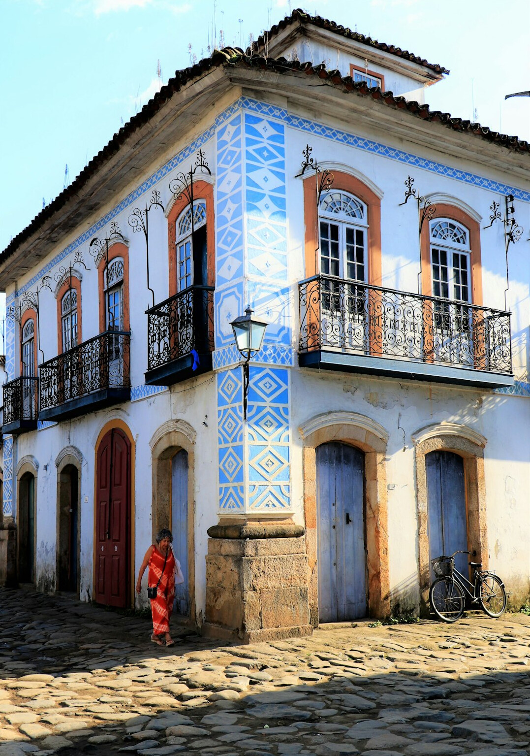 Brazilian woman writing in a journal by a window