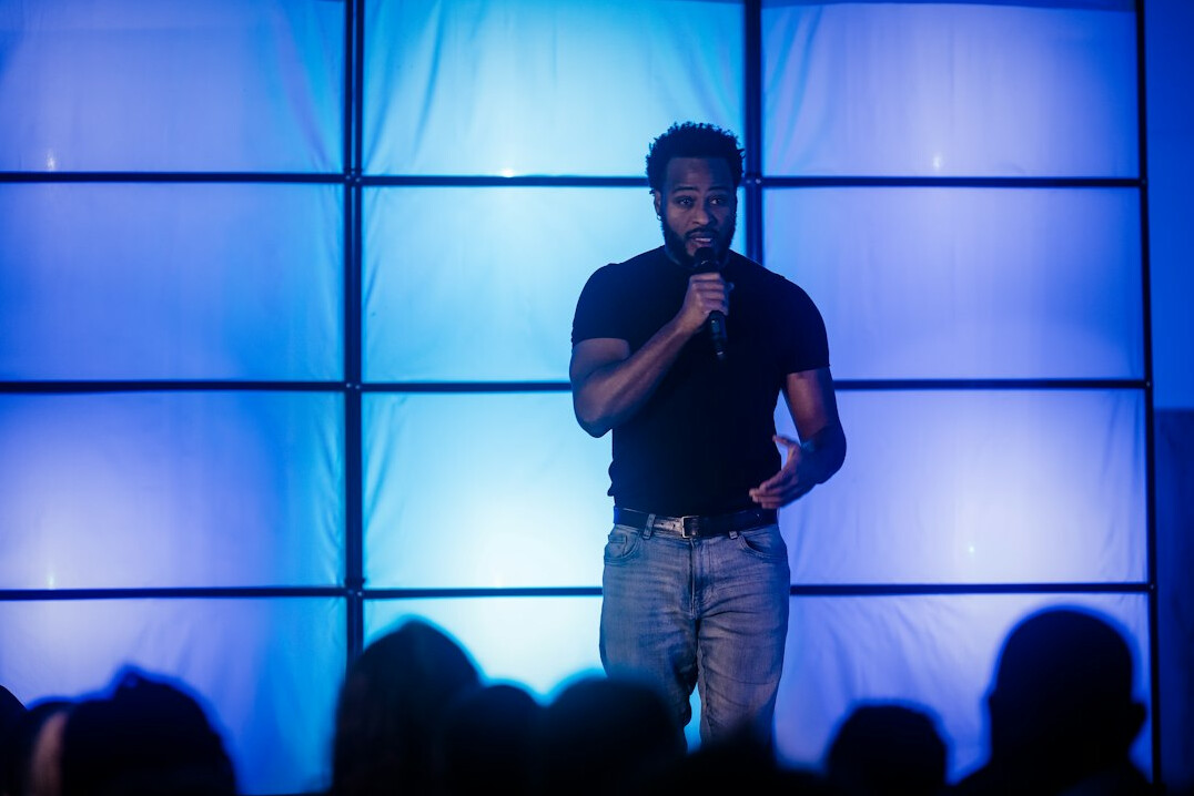 person speaking confidently on stage